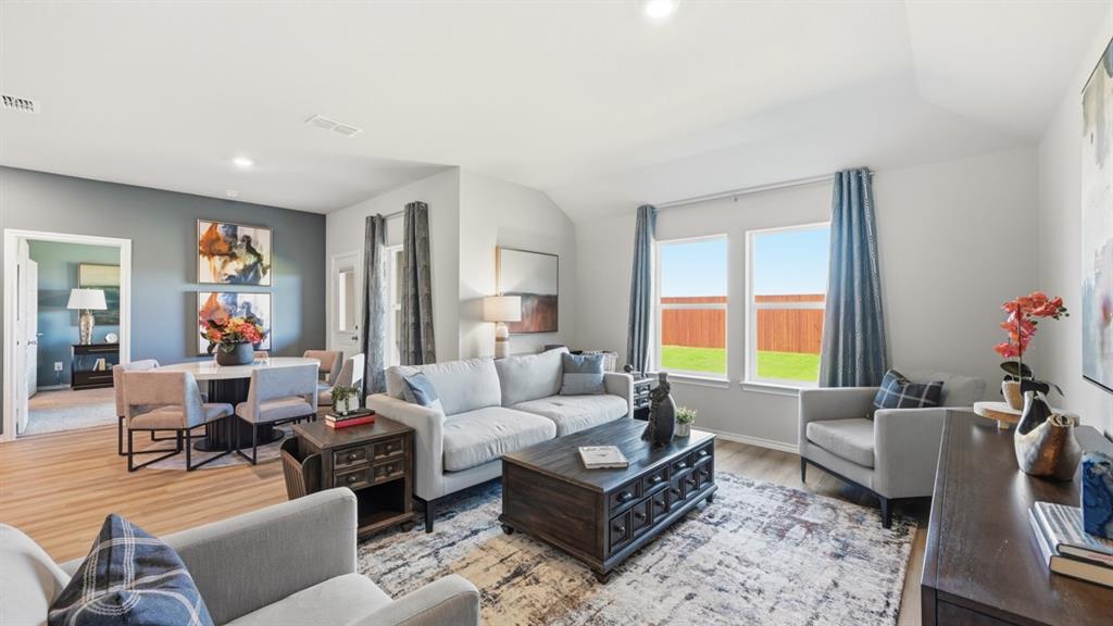 16500 Hudson Pr Way Justin, TX 76247 - Photo 10 of 38 a living room with furniture and a potted plant