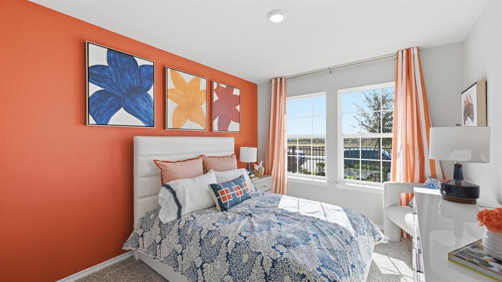 16500 Hudson Pr Way Justin, TX 76247 - Photo 28 of 38 a bed sitting in a bedroom next to a window