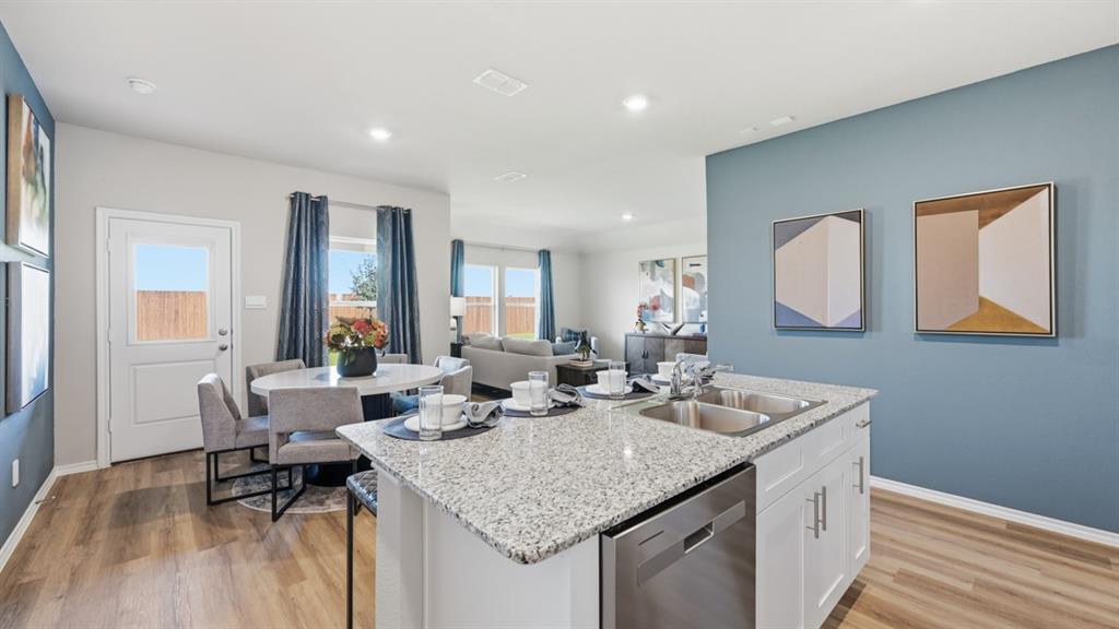 16500 Hudson Pr Way Justin, TX 76247 - Photo 4 of 38 a dining hall with stainless steel appliances granite countertop a granite counter tops and a wooden floors