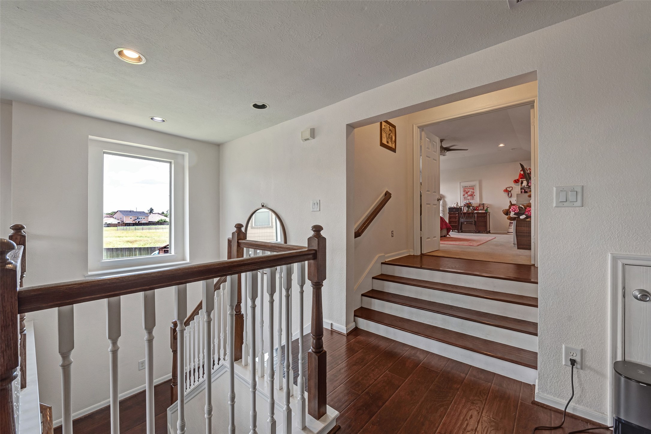 3554 Bennett Trails Drive Spring, TX 77386 - Photo 22 of 44 a view of a hallway with wooden floor and windows