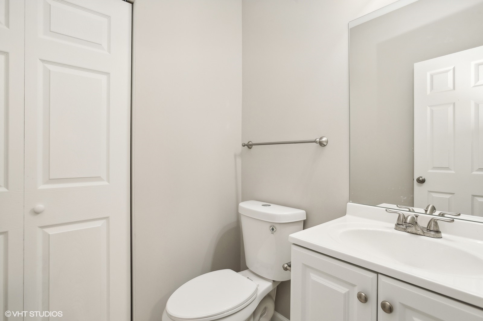 1489 Fox Path Lane Hoffman Estates, IL 60192 - Photo 22 of 27 a bathroom with a sink a toilet and a mirror