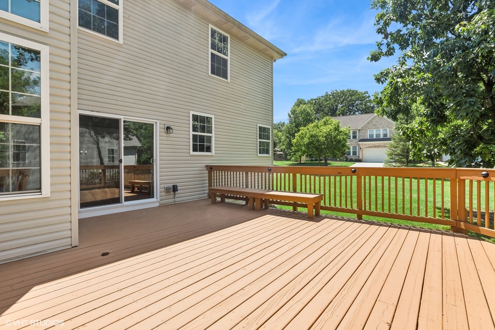 1489 Fox Path Lane Hoffman Estates, IL 60192 - Photo 24 of 27 a view of a deck with wooden floor and fence next to a yard