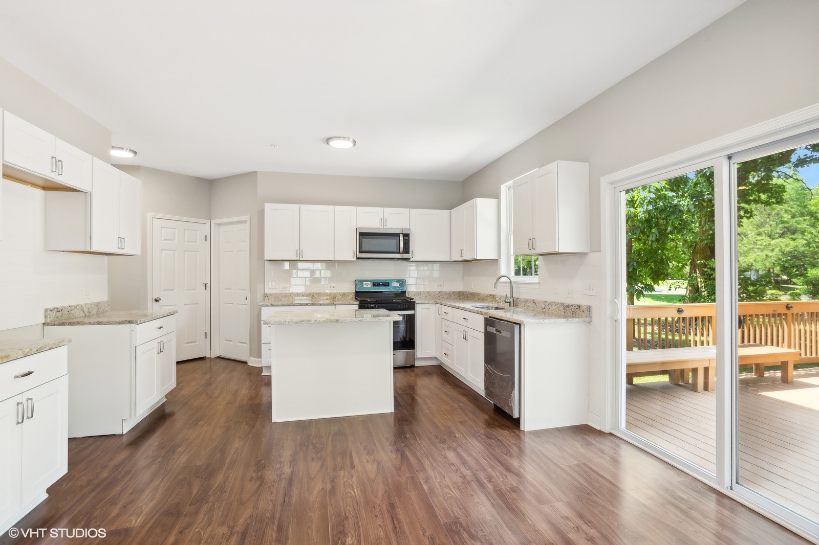 1489 Fox Path Lane Hoffman Estates, IL 60192 - Photo 5 of 27 a kitchen with white cabinets and white appliances
