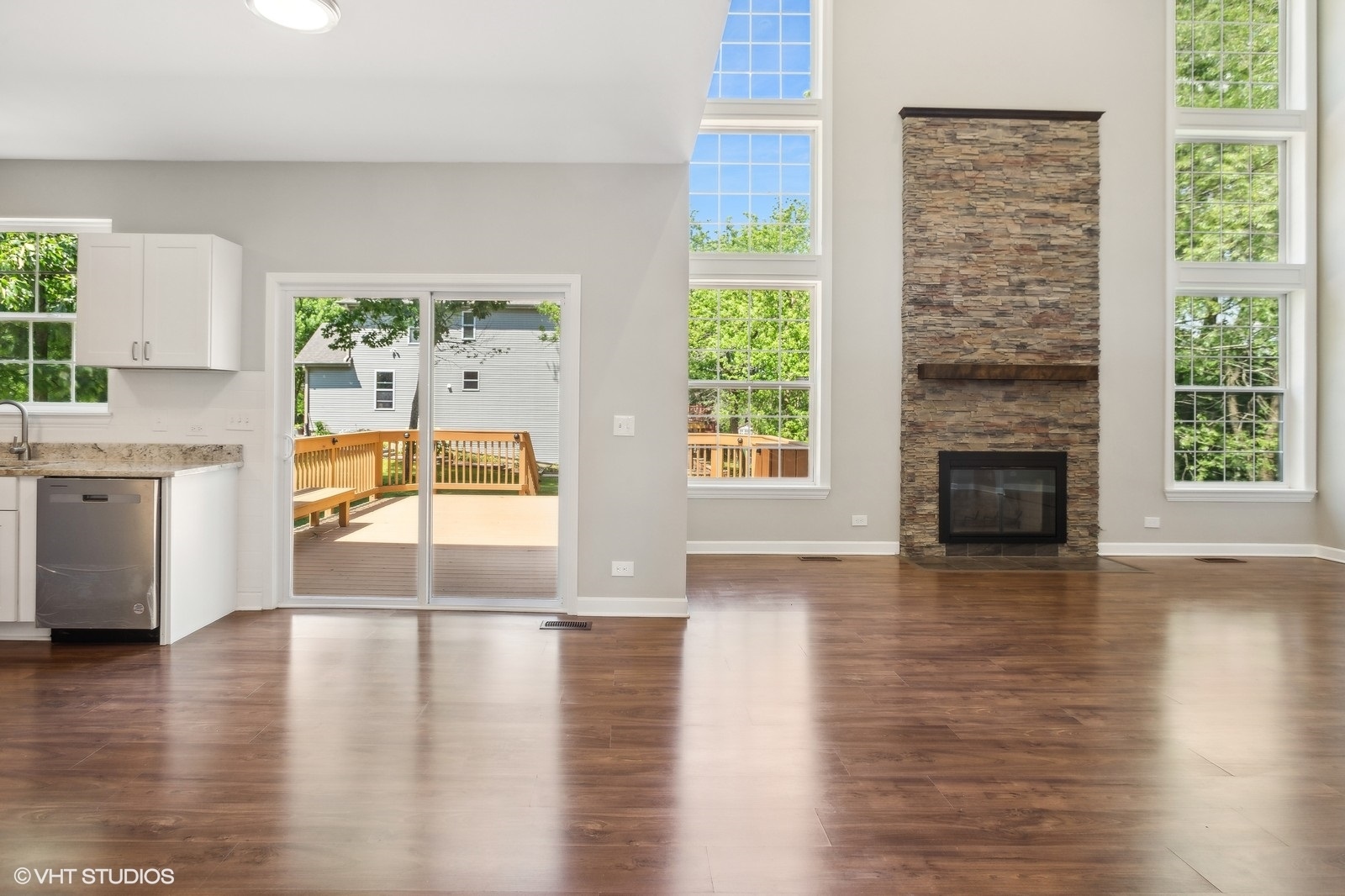 1489 Fox Path Lane Hoffman Estates, IL 60192 - Photo 7 of 27 a view of empty room with wooden floor and fireplace