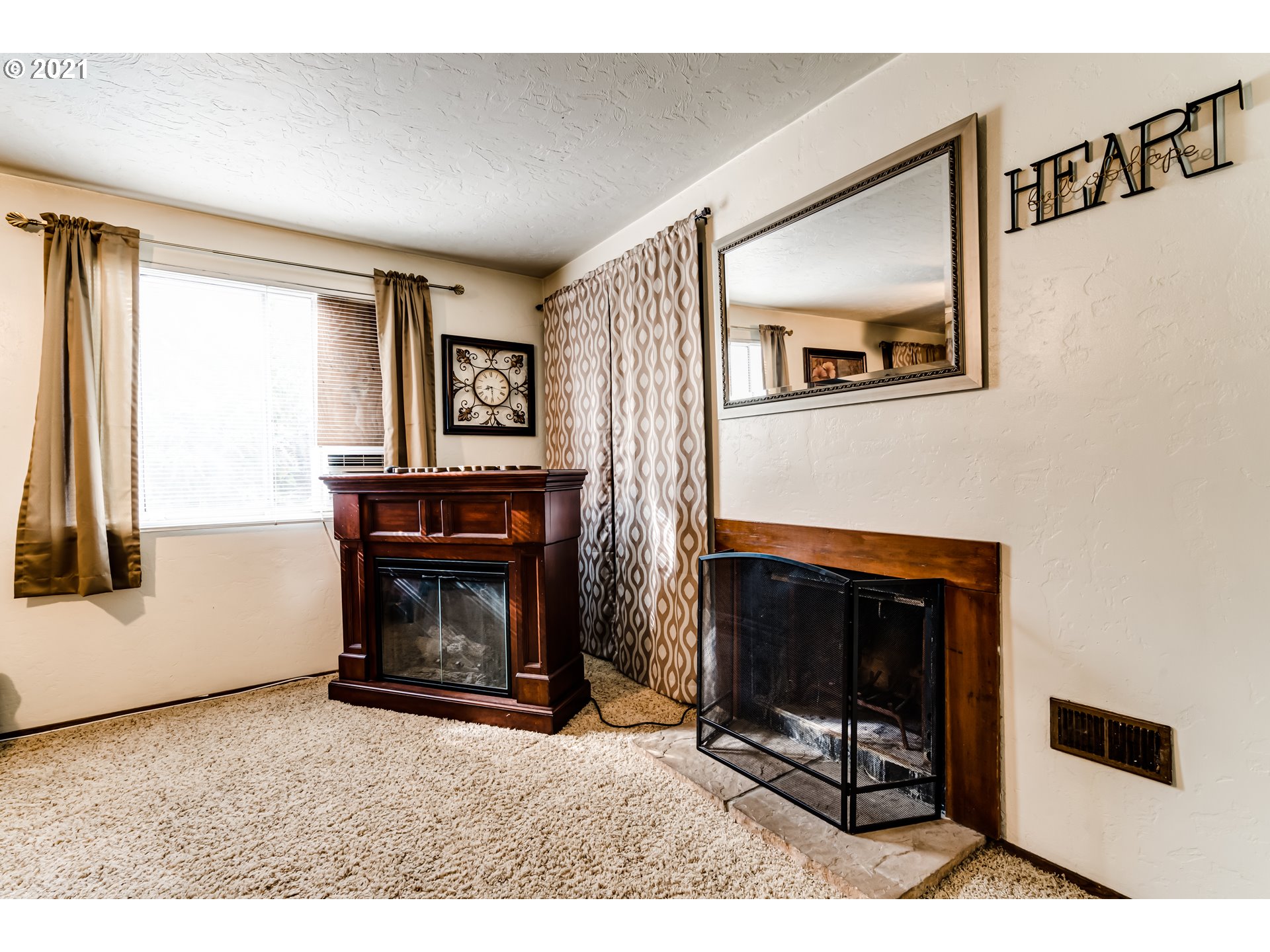146 South 63rd Street Springfield, OR 97478 - Photo 7 of 27 a living room with furniture and a fireplace