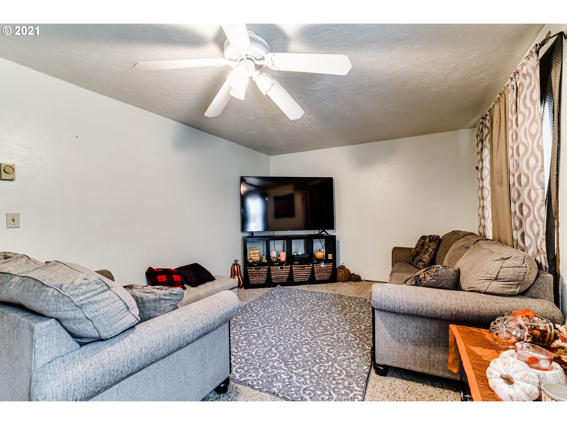 146 South 63rd Street Springfield, OR 97478 - Photo 9 of 27 a living room with furniture and a flat screen tv