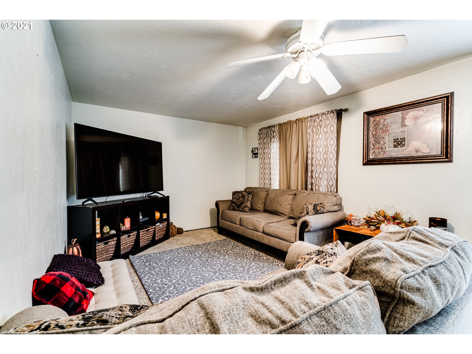 146 South 63rd Street Springfield, OR 97478 - Photo 10 of 27 a living room with furniture and a flat screen tv