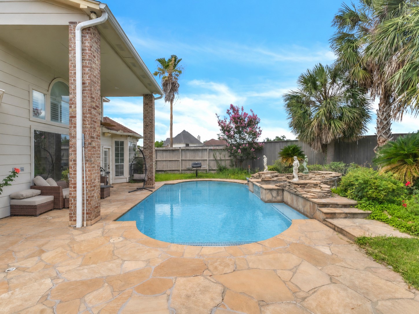 17902 St Emilion Court Spring, TX 77379 - Photo 37 of 38 Backyard with pool inground (pool water color have been edited by AI)