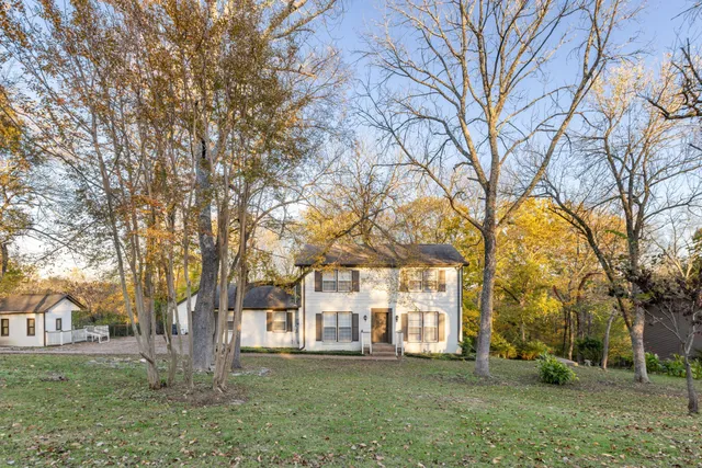 a view of a trees in front of a house