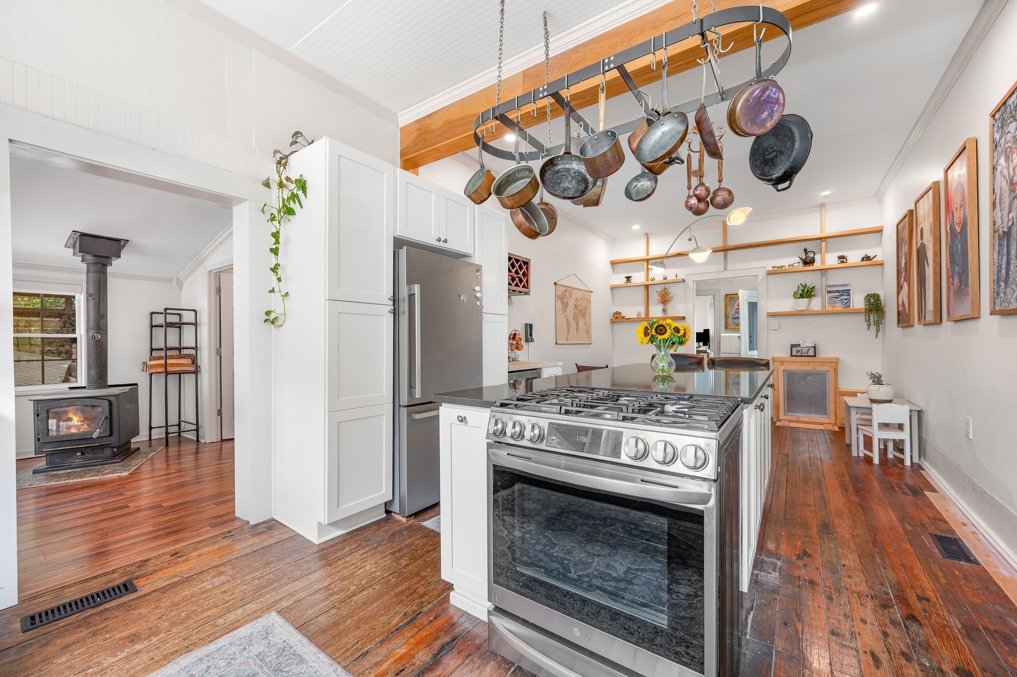 311 West 13th Street Columbia, TN 38401 - Photo 13 of 47 a kitchen with stainless steel appliances granite countertop a stove and a refrigerator