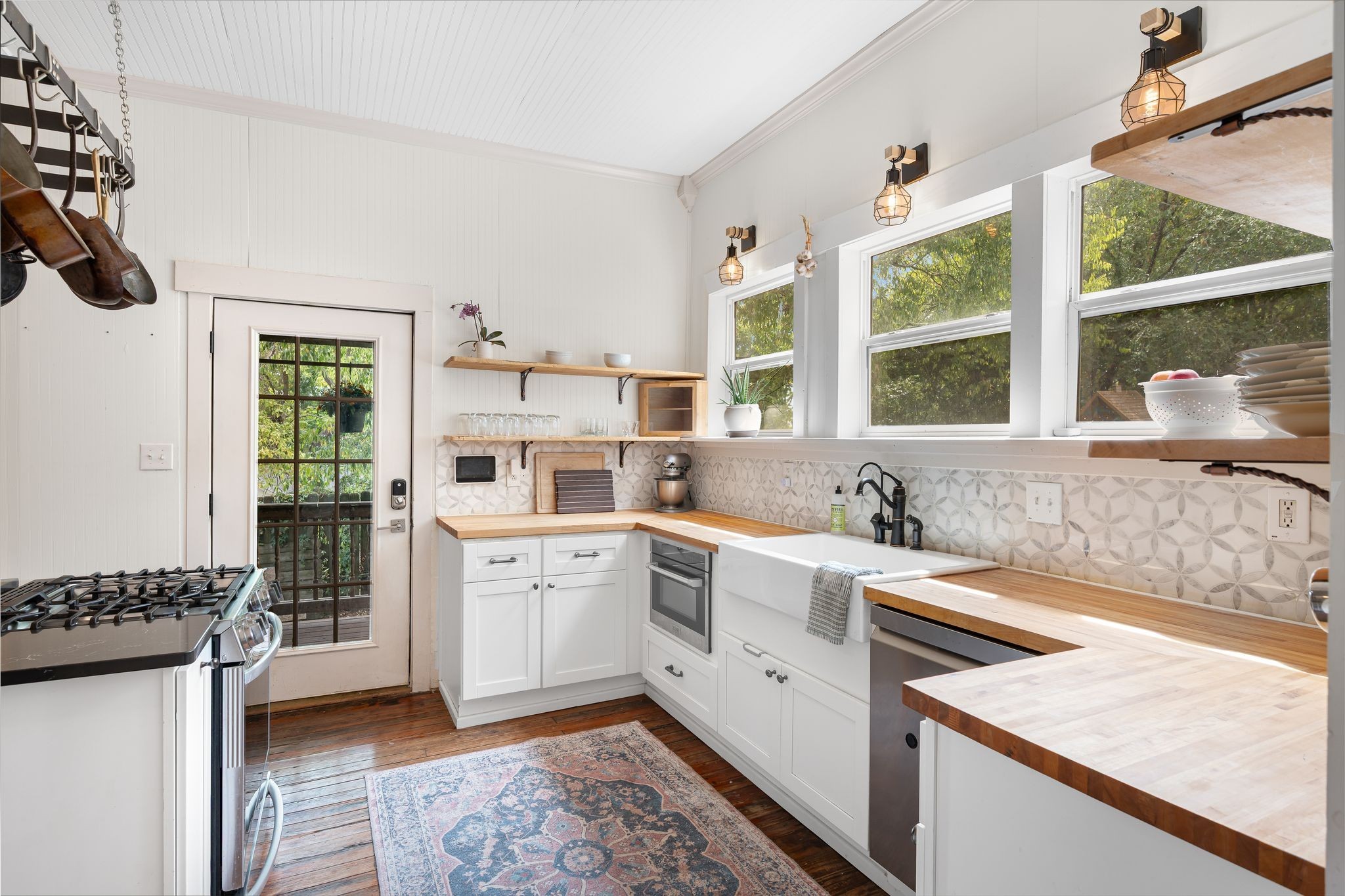 311 West 13th Street Columbia, TN 38401 - Photo 14 of 47 a kitchen with a stove a sink and a refrigerator