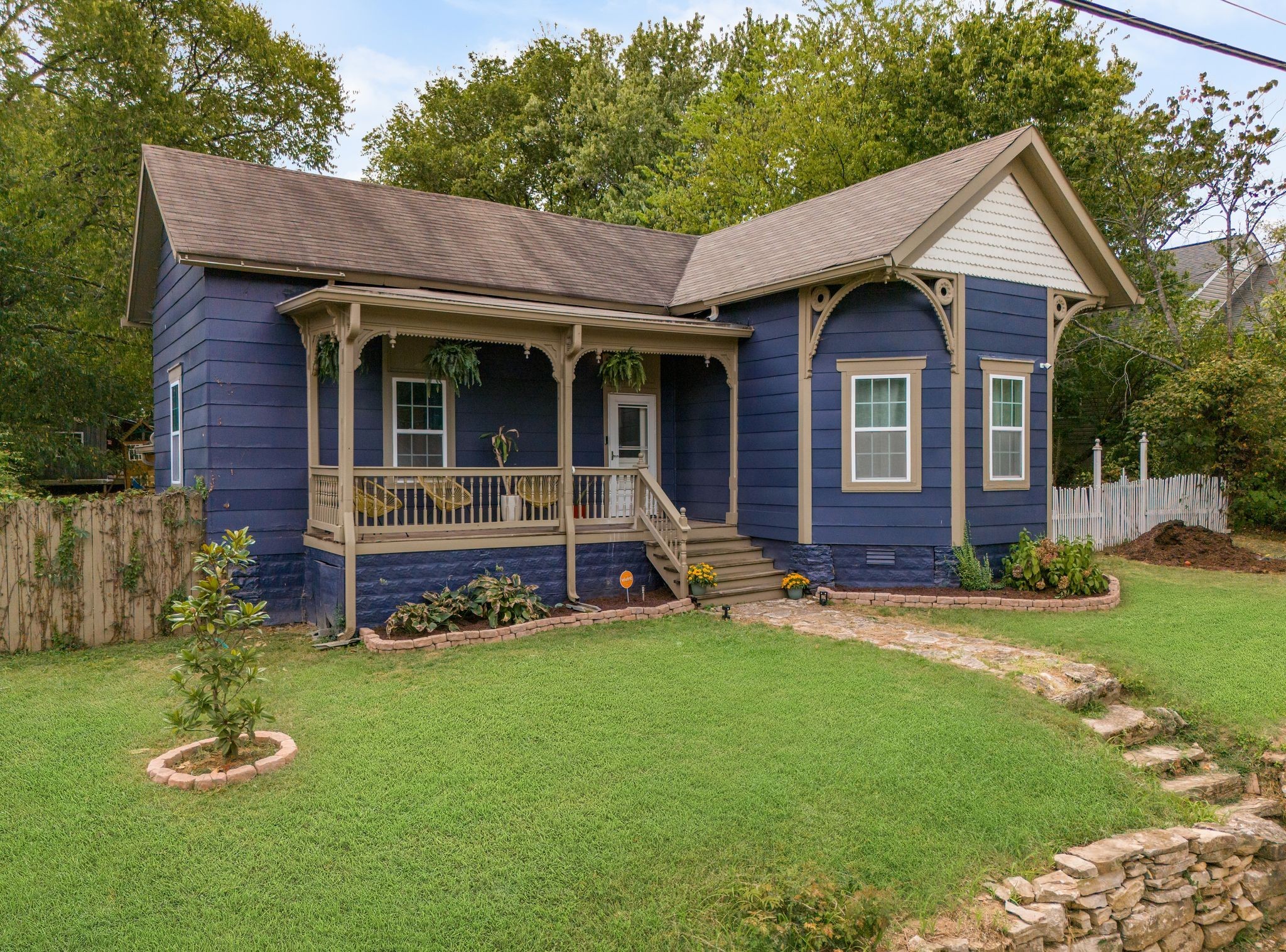 311 West 13th Street Columbia, TN 38401 - Photo 2 of 47 a front view of a house with a yard table and chairs