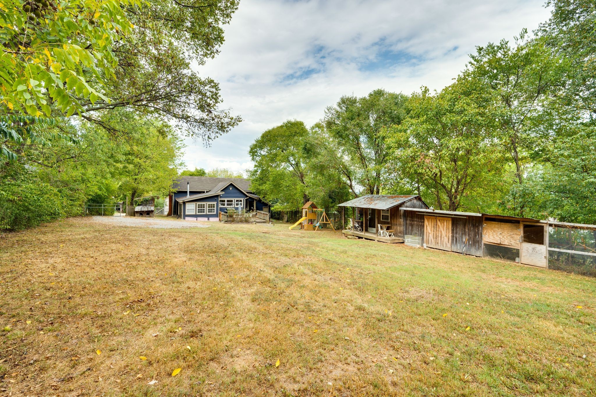 311 West 13th Street Columbia, TN 38401 - Photo 32 of 47 a yellow house with trees in front of it