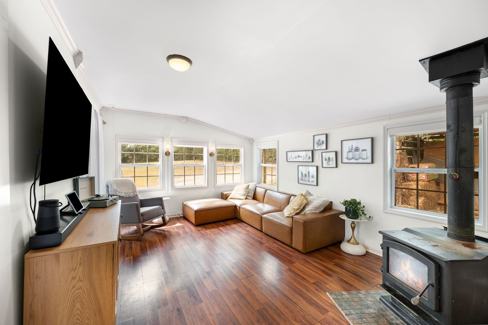 311 West 13th Street Columbia, TN 38401 - Photo 7 of 47 a living room with furniture floor to ceiling window hardwood floor and a flat screen tv