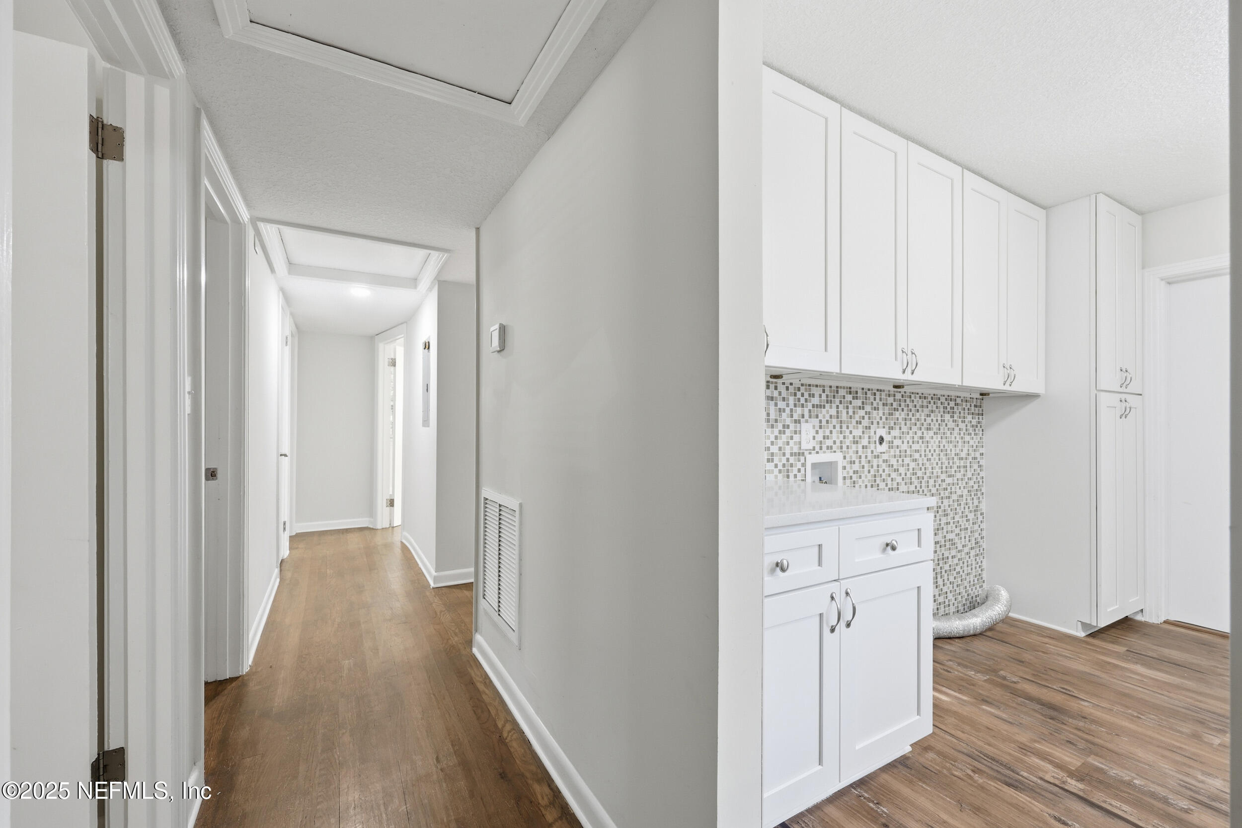 5201 Royce Avenue Jacksonville, FL 32205 - Photo 16 of 34 a view of a hallway with wooden floor