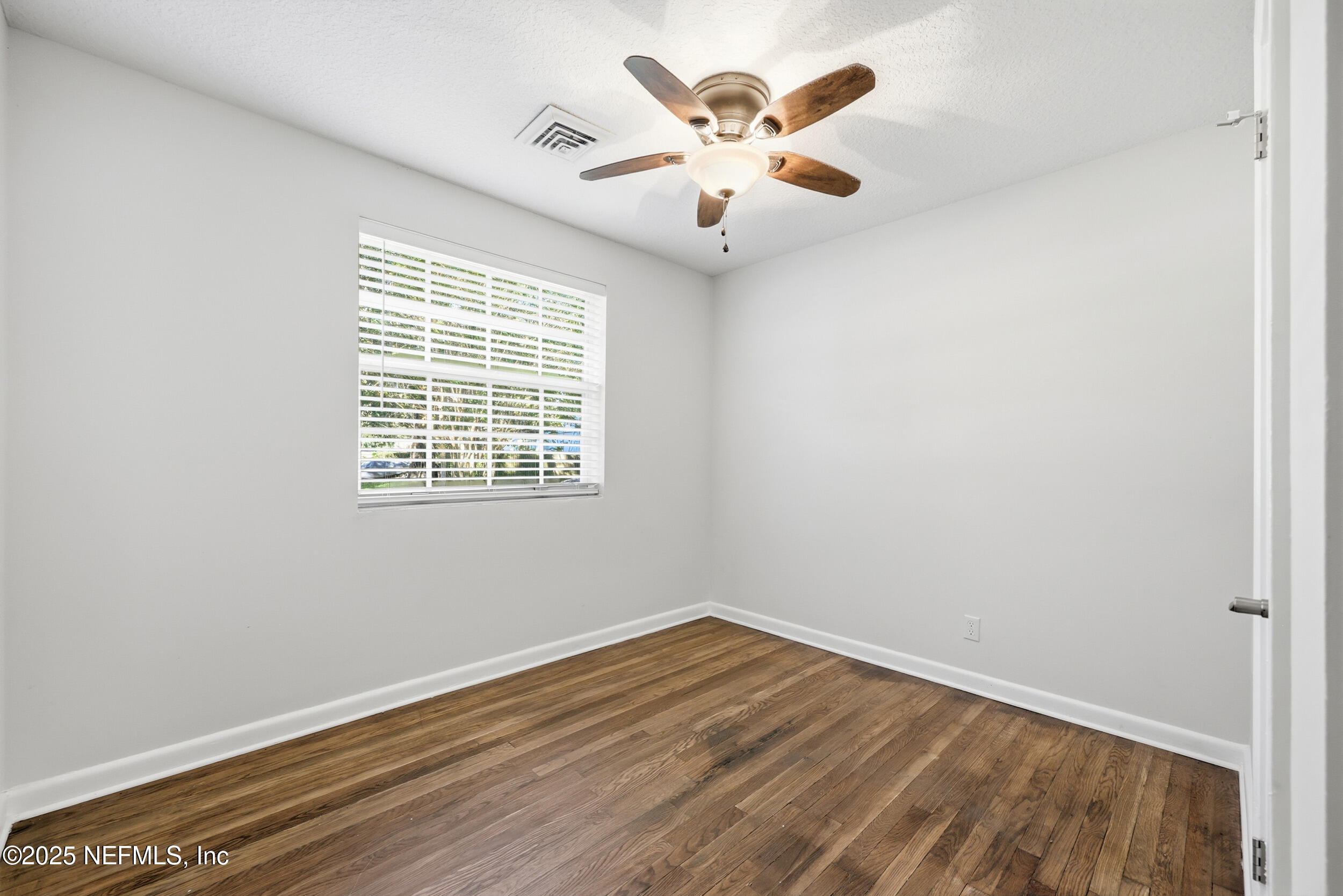 5201 Royce Avenue Jacksonville, FL 32205 - Photo 19 of 34 wooden floor in an empty room with a window