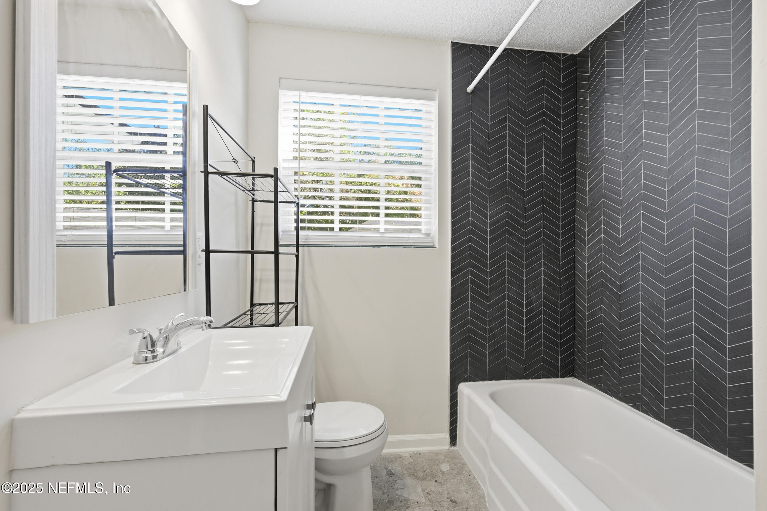 5201 Royce Avenue Jacksonville, FL 32205 - Photo 21 of 34 a bathroom with a sink toilet and shower