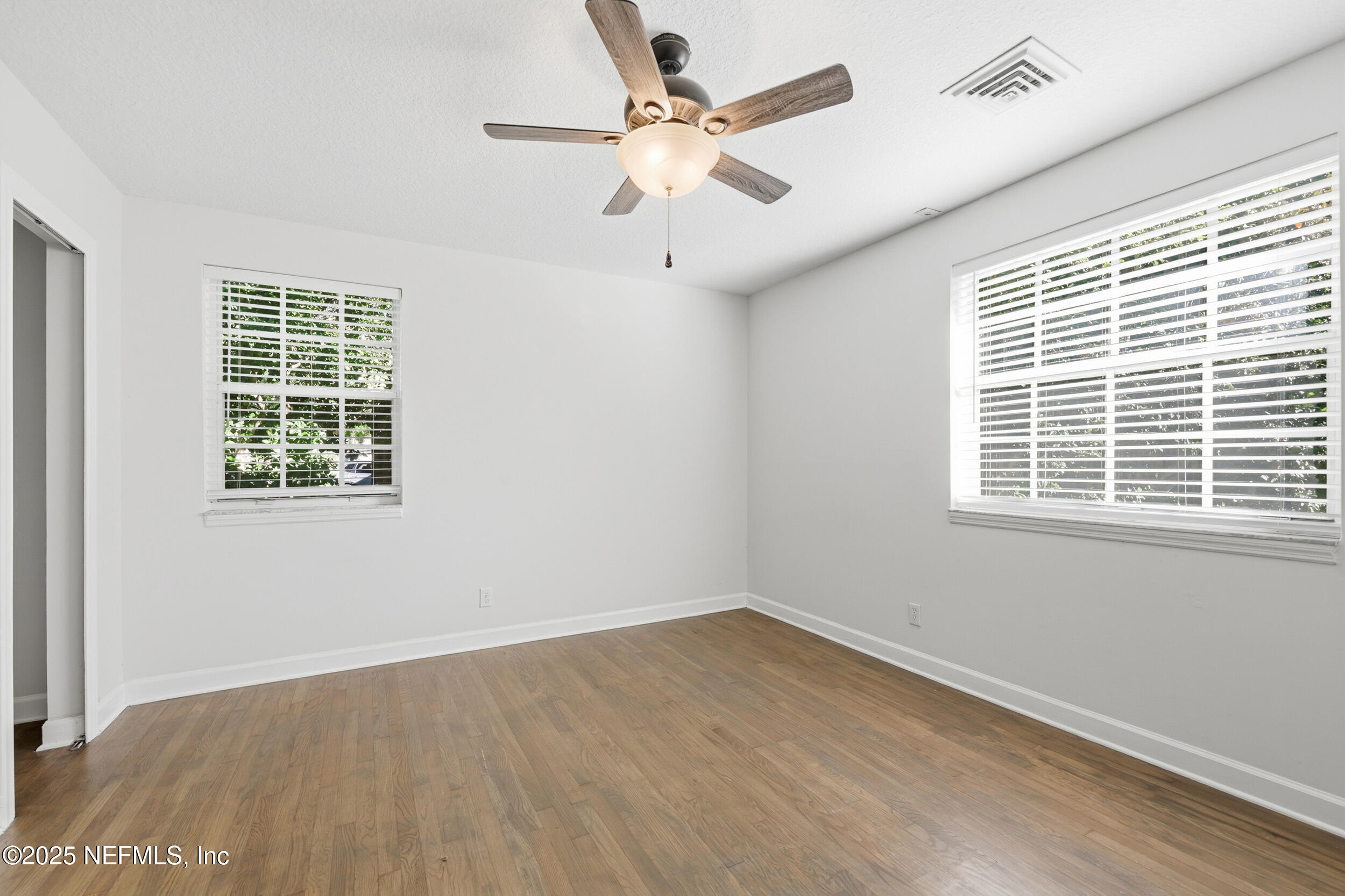 5201 Royce Avenue Jacksonville, FL 32205 - Photo 24 of 34 wooden floor in an empty room with a window