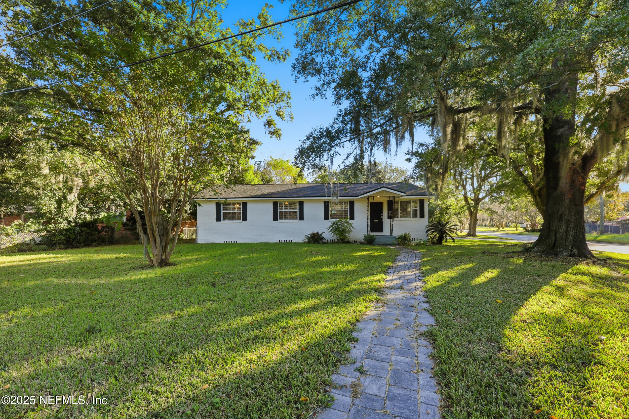 5201 Royce Avenue Jacksonville, FL 32205 - Photo 31 of 34 a front view of a house with a garden