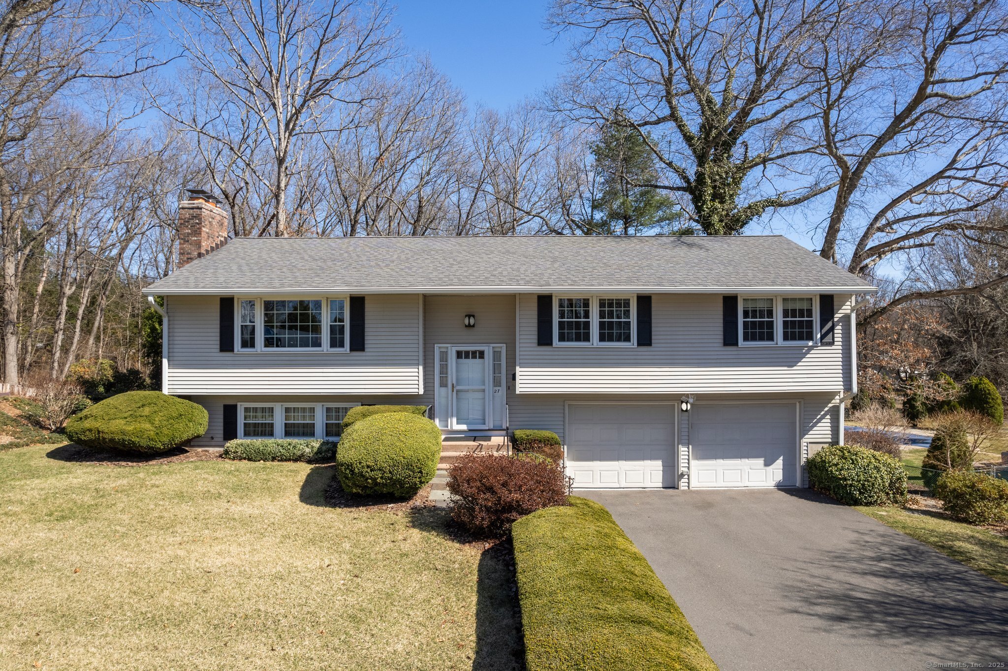 27 Kennedy Road Manchester, CT 06042 - Photo 1 of 1 a front view of a house with a yard and garage