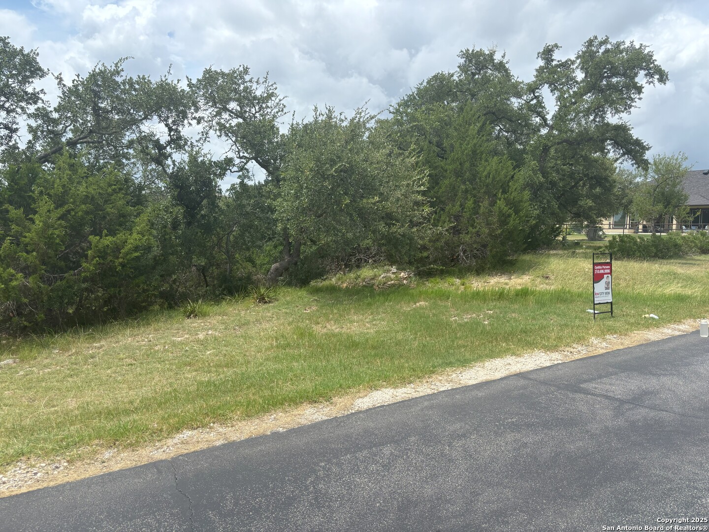 606 Lantana Mesa Spring Branch, TX 78070 - Photo 3 of 10 a view of a yard with a tree