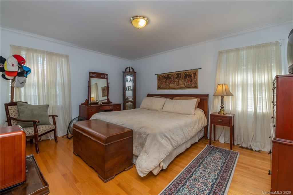 190 South Ridgecrest Street Rutherfordton, NC 28139 - Photo 20 of 26 a bedroom with a bed and wooden floor