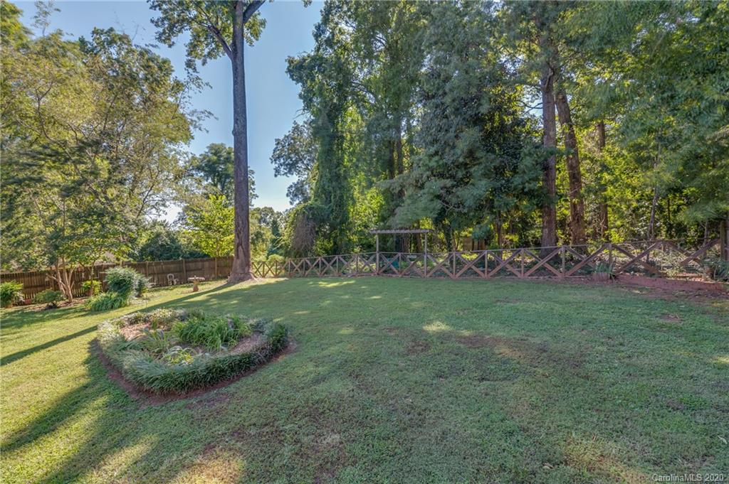 190 South Ridgecrest Street Rutherfordton, NC 28139 - Photo 8 of 26 a view of a garden with lawn chairs