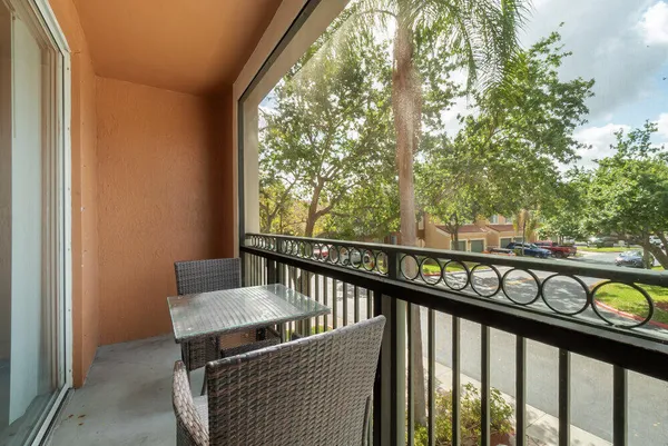 a view of a balcony with furniture