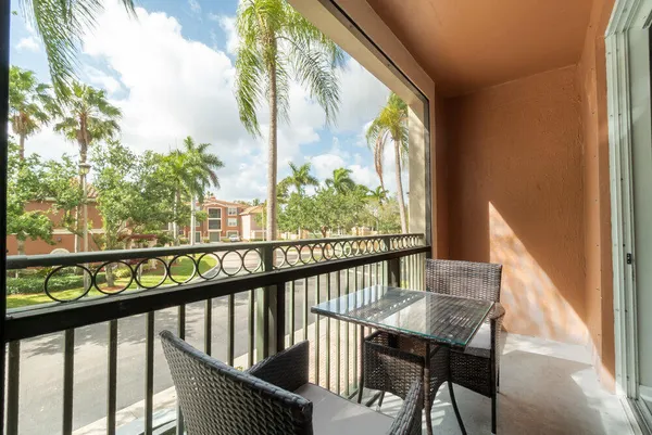 a view of a balcony with furniture