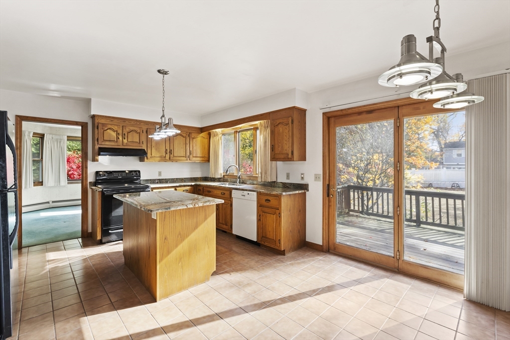 43 Maple Road Westford, MA 01886 - Photo 11 of 31 a kitchen with stainless steel appliances granite countertop a stove and a sink
