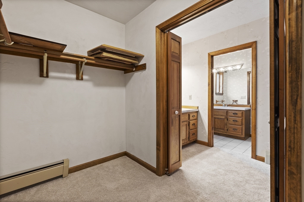 43 Maple Road Westford, MA 01886 - Photo 17 of 31 a view of a hallway with a bedroom