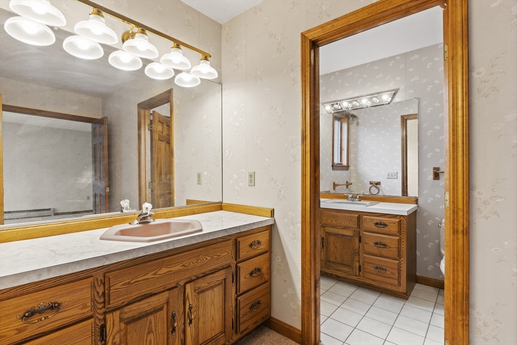 43 Maple Road Westford, MA 01886 - Photo 18 of 31 a bathroom with a sink double vanity and a mirror