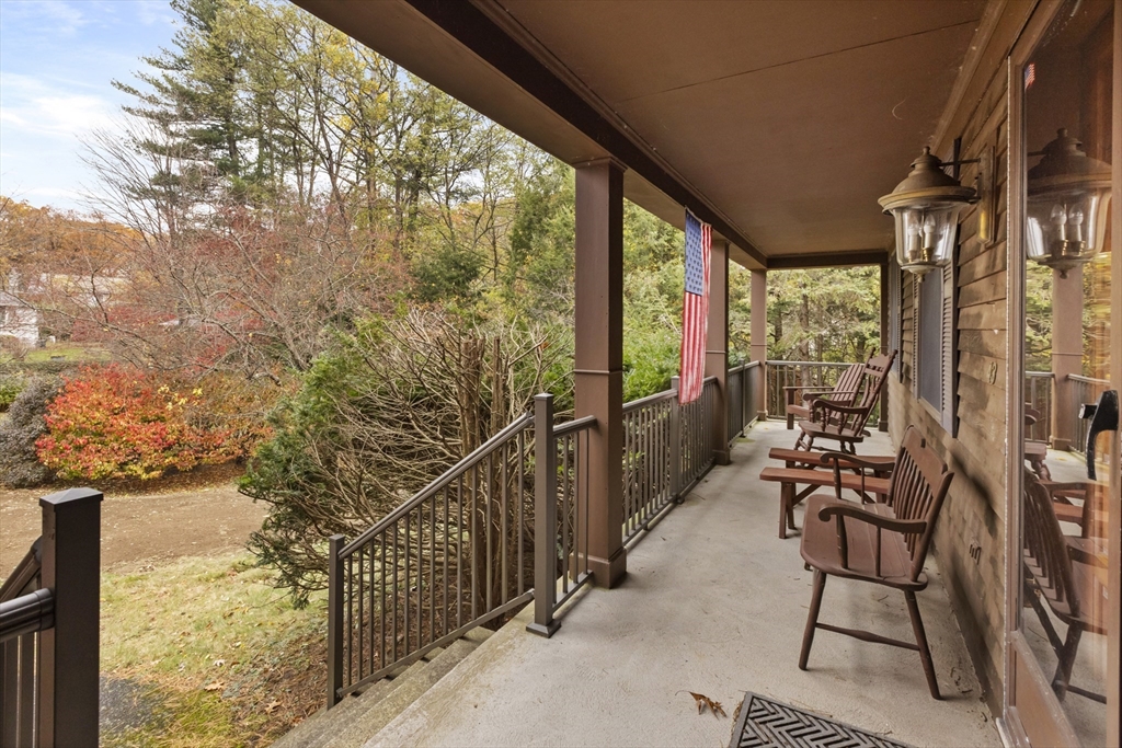 43 Maple Road Westford, MA 01886 - Photo 3 of 31 a view of a chairs and table in the balcony