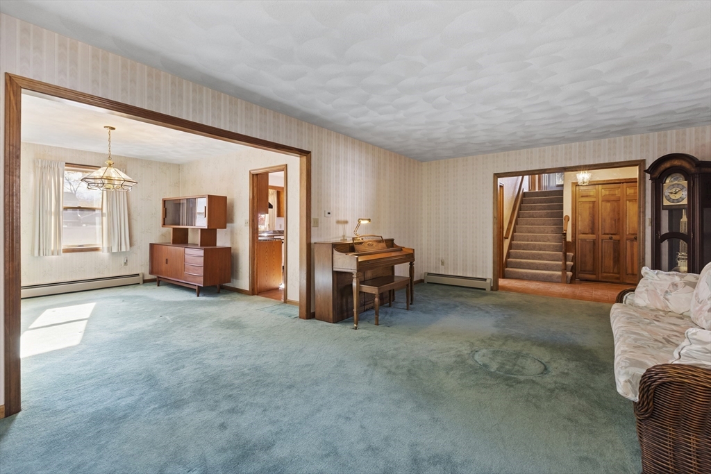 43 Maple Road Westford, MA 01886 - Photo 6 of 31 a living room with furniture and large windows