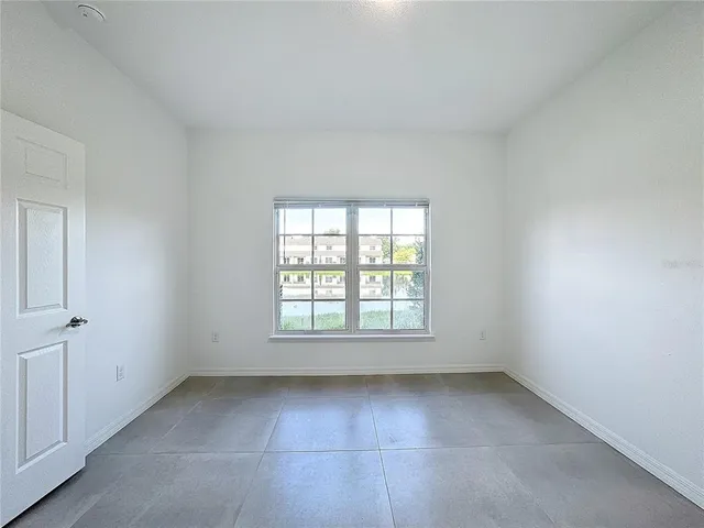 a white toilet sitting next to a bath tub