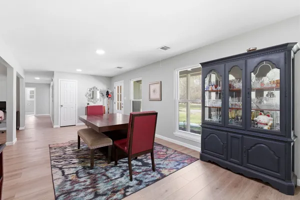 a work room with furniture and wooden floor