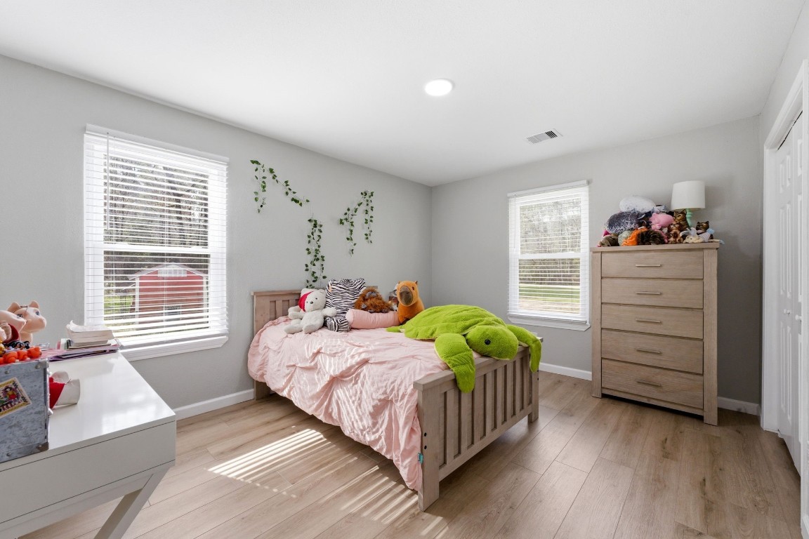5222 Ranch Hill Drive Magnolia, TX 77354 - Photo 19 of 41 a bedroom with a bed and a window