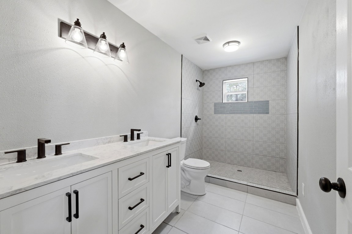 5222 Ranch Hill Drive Magnolia, TX 77354 - Photo 23 of 41 a bathroom with a sink a toilet and shower