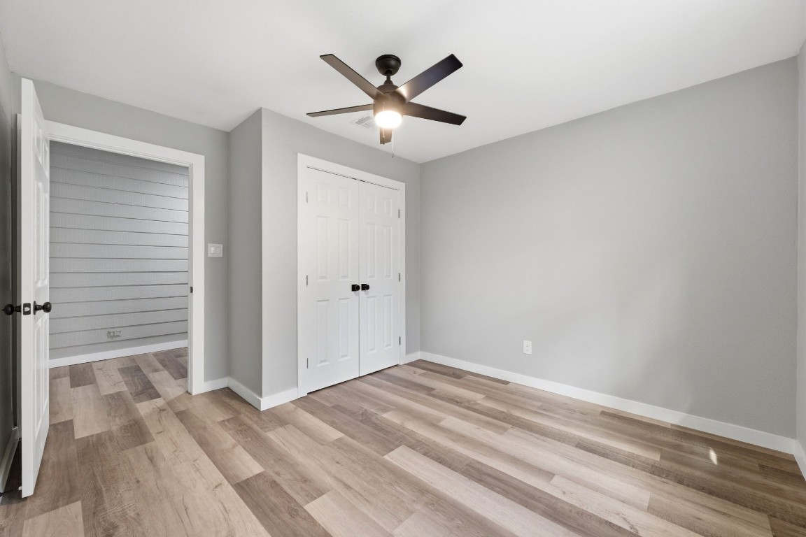 5222 Ranch Hill Drive Magnolia, TX 77354 - Photo 24 of 41 a view of a livingroom with a ceiling fan & wooden floor