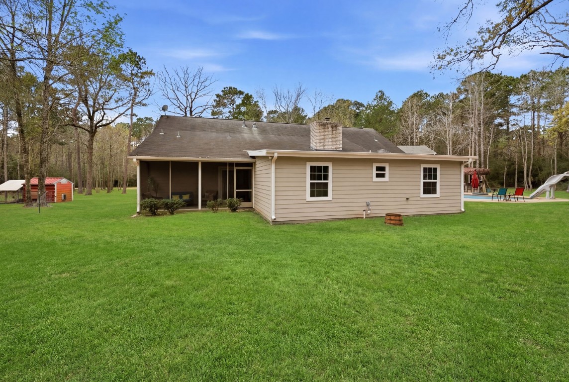 5222 Ranch Hill Drive Magnolia, TX 77354 - Photo 27 of 41 a view of a house with a backyard