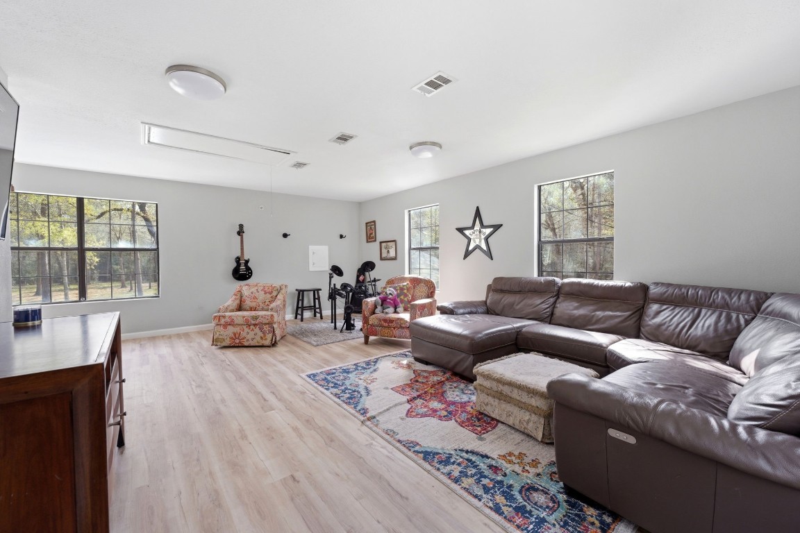 5222 Ranch Hill Drive Magnolia, TX 77354 - Photo 29 of 41 a living room with furniture and a large window