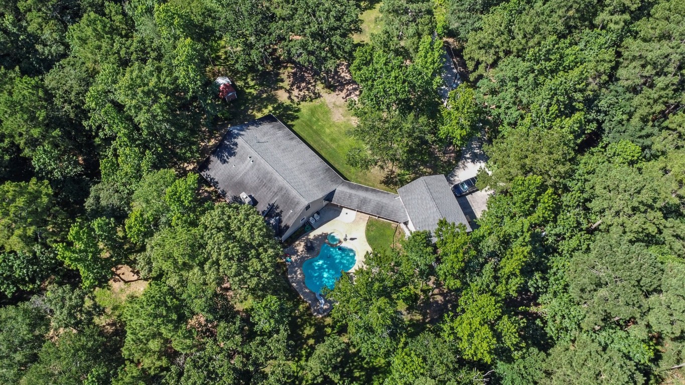 5222 Ranch Hill Drive Magnolia, TX 77354 - Photo 3 of 41 an aerial view of a house with yard and outdoor seating