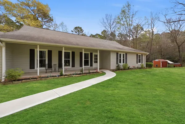 a front view of a house with a yard
