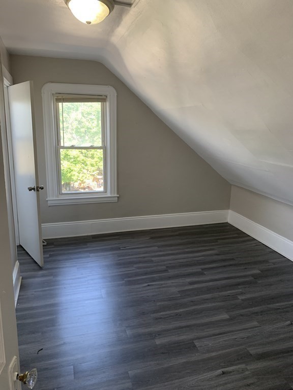 935 Liberty Street Springfield, MA 01104 - Photo 11 of 11 an empty room with wooden floor and windows