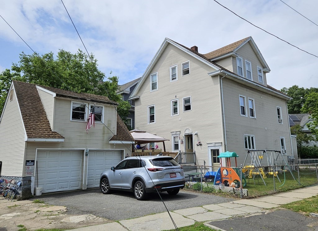 935 Liberty Street Springfield, MA 01104 - Photo 2 of 11 a front view of a house with garage