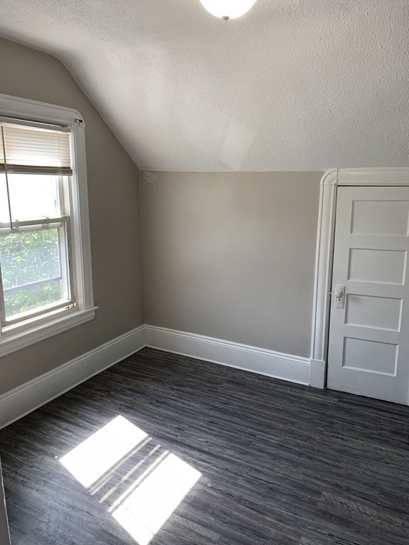 935 Liberty Street Springfield, MA 01104 - Photo 6 of 11 wooden floor in an empty room with a window