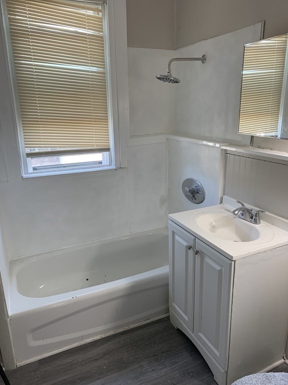 935 Liberty Street Springfield, MA 01104 - Photo 10 of 11 a bathroom with a bathtub and a sink