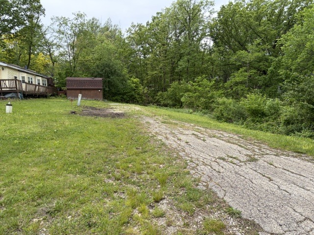 2975 East 28th Road Marseilles, IL 61360 - Photo 3 of 45 a view of a backyard with a garden