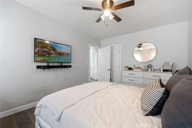 a bedroom with bed and a chandelier