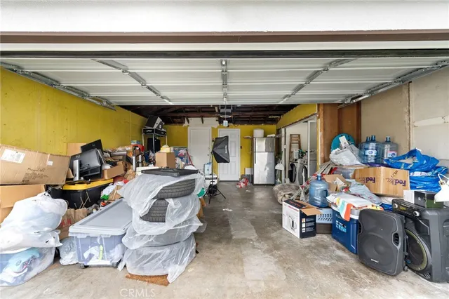 an aerial view of a house with yard and swimming pool